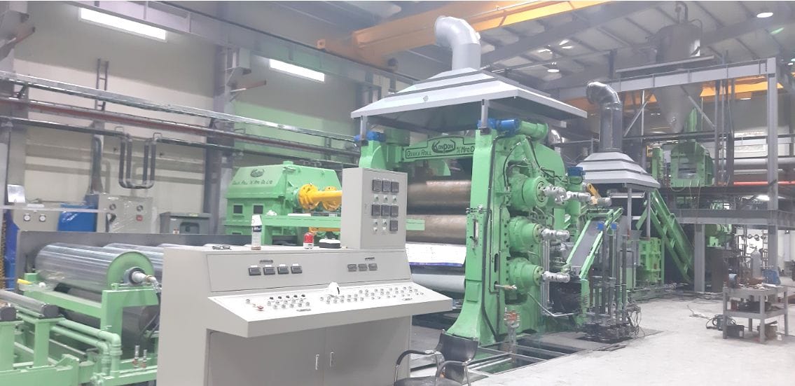 Rolling and forming the wear layer fabric on the calender line